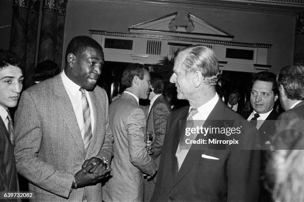 Duke Of Edinburgh meets Frank Bruno at the Variety Club's sports lunch at the Dorchester, London, 24th May 1988.