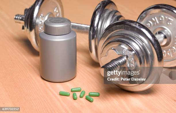 weights and steroids - exercise pill stock pictures, royalty-free photos & images