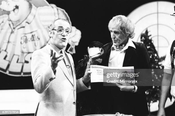 Rod Hulll and Emu seen here with Jim Bowen during a cheque presentation to the NSPCC during the record of Bullseye. 28th October 1984.