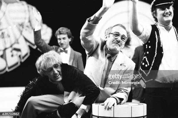 Rod Hulll and Emu seen here with Jim Bowen during a cheque presentation to the NSPCC during the record of Bullseye. 28th October 1984.