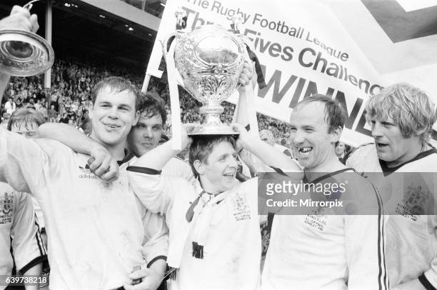 Widnes rugby league players celebrate, left to right Eddie Cunningham, Andy Gregory and Mick George, after their victory over Hull Kingston Rovers in...