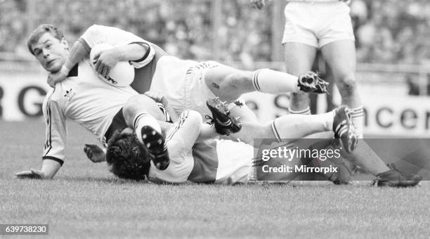 Widnes player is brought down by a high tackle during the Rugby League Cup Final against Hull Kingston Rovers at Wembley. Widnes went on to win the...