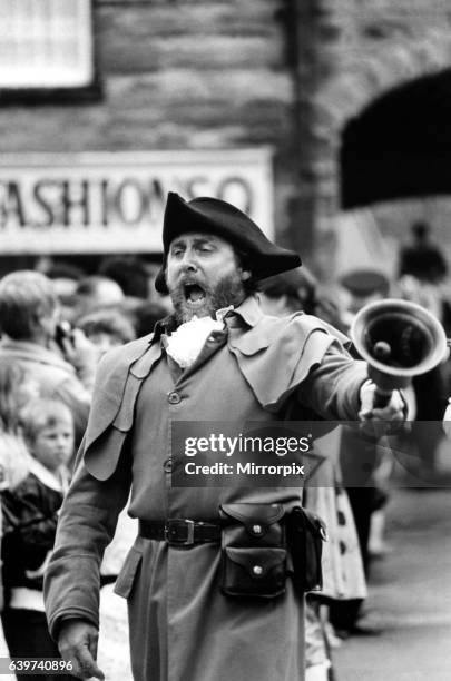 Alnwick Town Crier John Stevenson heads the procession through the town 26 June 1983.
