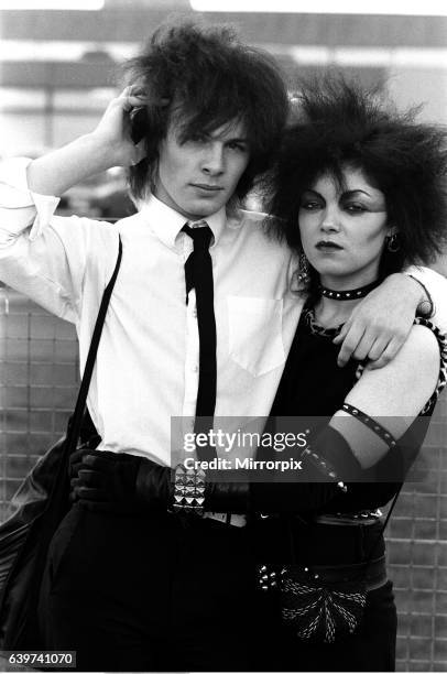 Punk love, Brian McEnaney 15 and Lesley Smith 24 kiss over theschool yard fence. 30th December 1981.