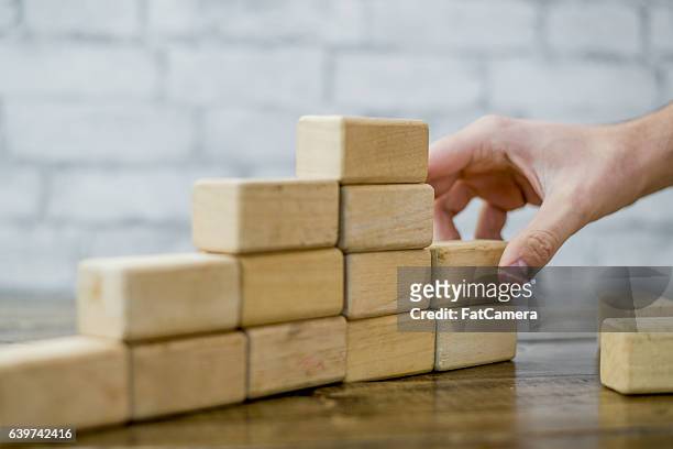 building a 3d graph - wood block stacking stock pictures, royalty-free photos & images