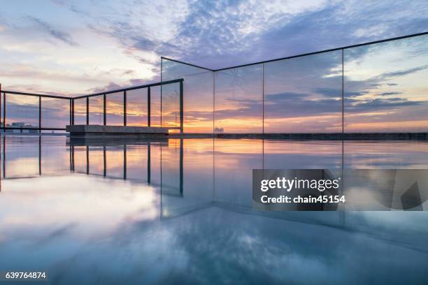 sky pool and sky bar in the city during sunset. - roof top bar foto e immagini stock