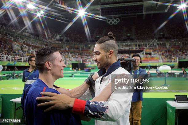 Gymnastics - Olympics: Day 9 Alexander Naddour of the United States and Louis Smith of Great Britain congratulate each other after their silver and...