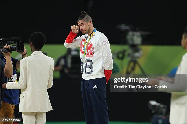 Gymnastics - Olympics: Day 9 Louis Smith of Great Britain, in tears on the podium after winning the silver medal in the Men's Pommel Horse Final with...