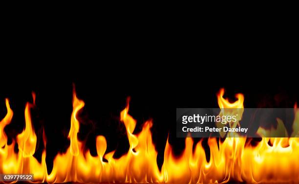 flames against black background - 火災 ストックフォトと画像