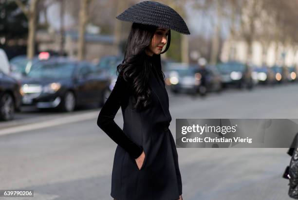 Guest wearing a black hat outside Dior on January 23, 2017 in Paris, Canada.