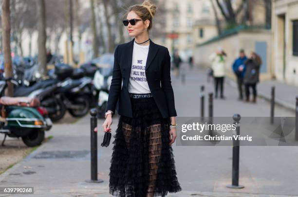 Chiara Ferragni wearing a white Dior tshirt We should all be feminists, black blazer and sheer skirt Dior outside Dior on January 23, 2017 in Paris,...