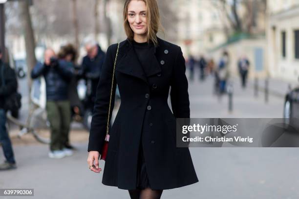 Sofia Sanchez de Betak wearing a black waisted coat outside Dior on January 23, 2017 in Paris, Canada.