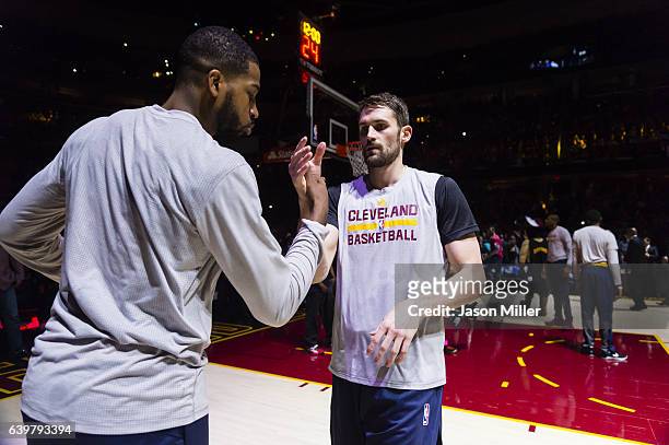 Tristan Thompson of the Cleveland Cavaliers greets Kevin Love during the player introduction prior to the game against the San Antonio Spurs at...