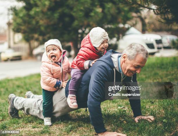 we exercise togather - active happy senior men stock pictures, royalty-free photos & images