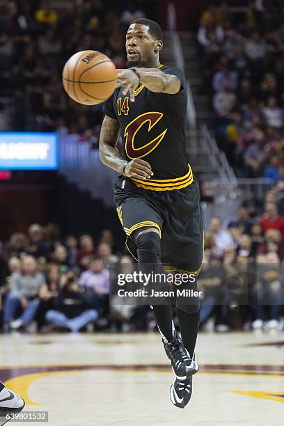 DeAndre Liggins of the Cleveland Cavaliers passes during the first half against the San Antonio Spurs at Quicken Loans Arena on January 21, 2017 in...