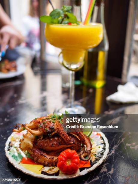 octopus and mango daiquiri in havana, cuba - havana cocktail stock pictures, royalty-free photos & images