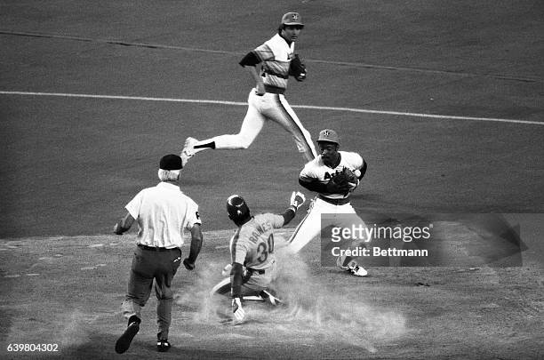 Montreal Expo Tim Raines steals second base easily in the first inning of the 8/17 game at the Astrodome. Bobbling the late throw is Astros second...