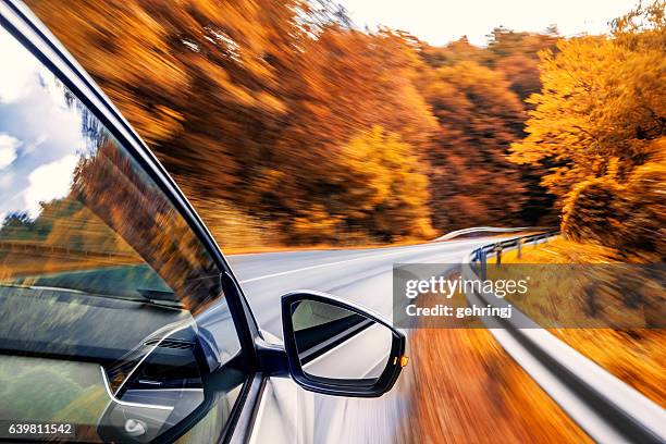 driving in the fall - fall road trip stock pictures, royalty-free photos & images