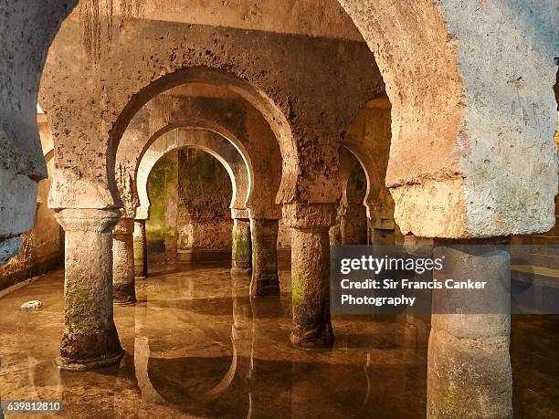 medieval moorish water cistern in caceres, spain, a unesco heritage site - extremadura stockfoto's en -beelden