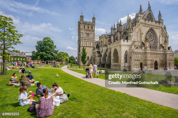 exeter cathedral and cathedral green - exeter cathedral stock pictures, royalty-free photos & images