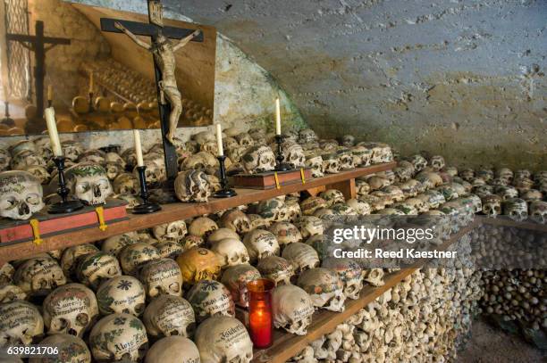 the world-famous skulls of  charnel house in st. michael’s chapel, hallstatt, austria - the cemetery for foreigners stock pictures, royalty-free photos & images