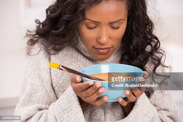 woman enjoying soup. - soup stock pictures, royalty-free photos & images