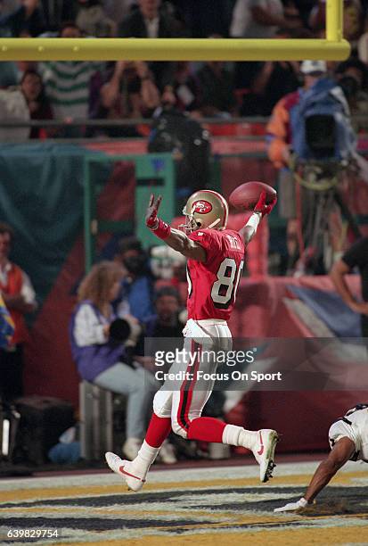 Jerry Rice of the San Francisco 49ers celebrates after scoring a touchdown against the San Diego Chargers during Super Bowl XXIX on January 29, 1995...