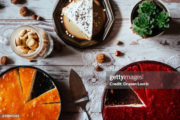 cheese cake with fruit topping and chocolate cake - cheesecake overhead stock pictures, royalty-free photos & images