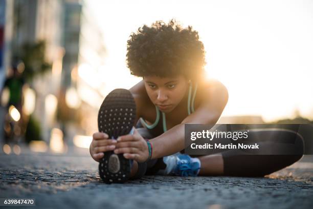 teenager exercises in city at sunset - skinny teen ストックフォトと画像