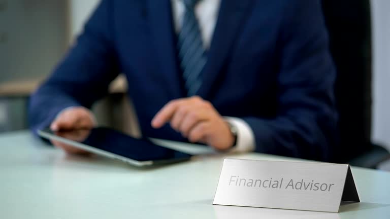 https://media.gettyimages.com/id/639862340/video/male-financial-advisor-working-on-tablet-pc-making-investment-plan-for-client.jpg?b=1&s=640x640&k=20&c=kvtT4HkwbbJ7URF42b-7uNwYR-EEb5ug1P0oDCgc0TQ=