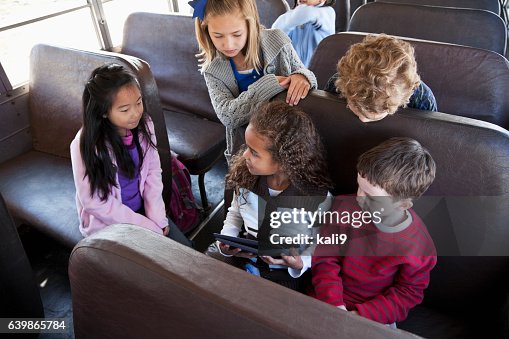 Kidd Rding Inside A Shuttle Children Sitting Inside School Bus With Digital Tablet High-Res Stock ...