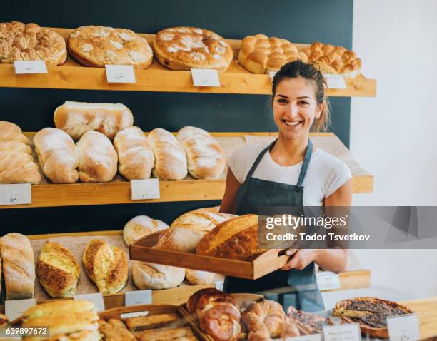 young female baker - bread shop stock pictures, royalty-free photos & images