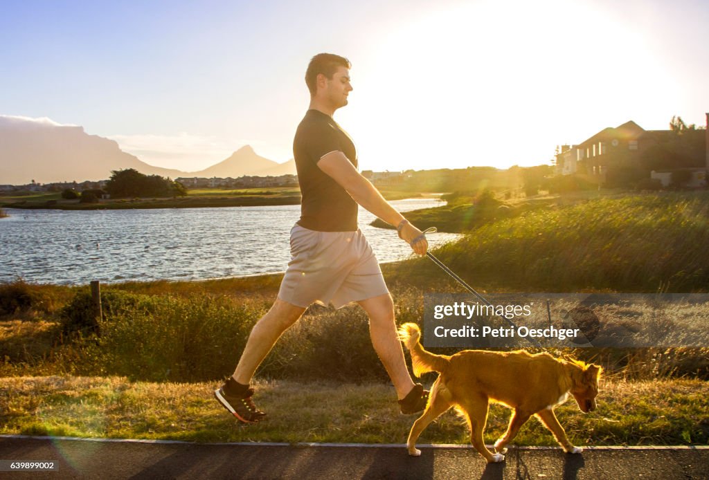 Man walking his dog.