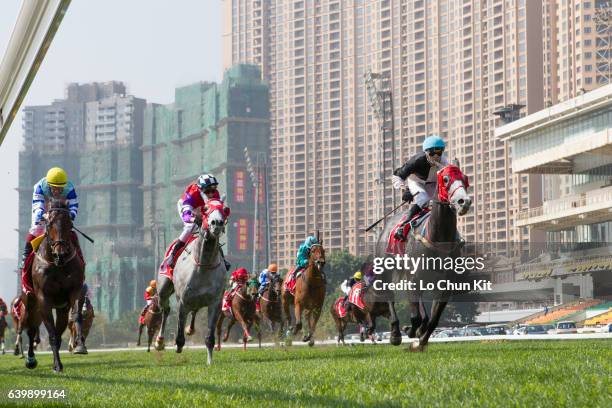 Jockey Andrew Calder riding Obrigado Mais wins the Race 2 Kampek Paradise International Mixed Doubles Jockeys Challenge Plate at the Taipa Racecourse...