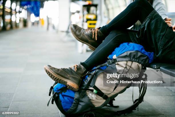 close up shot of legs and rucksack of a young backpacker - low section woman stock pictures, royalty-free photos & images