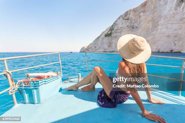 woman on sailboat in the blue sea. zakynthos, greek islands, greece - greek islands stock pictures, royalty-free photos & images