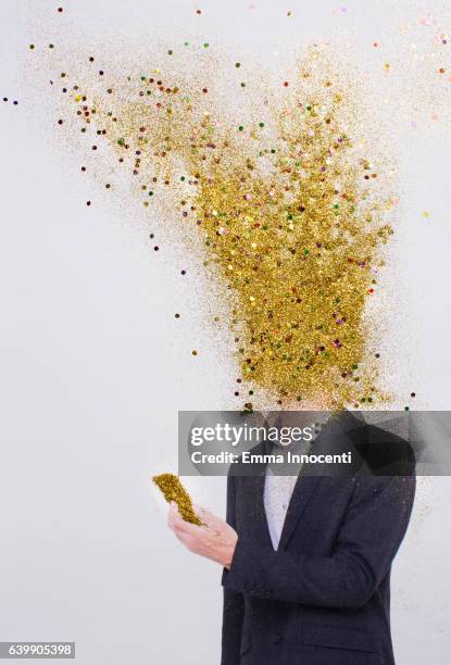 business man head exploding into gold dust - obscured face phone stock pictures, royalty-free photos & images