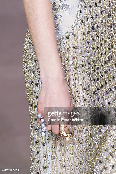 Model, jewel detail, walks the runway during the Georges Hobeika Spring Summer 2017 show as part of Paris Fashion Week on January 23, 2017 in Paris,...