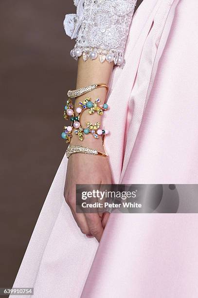 Model, jewel detail, walks the runway during the Georges Hobeika Spring Summer 2017 show as part of Paris Fashion Week on January 23, 2017 in Paris,...