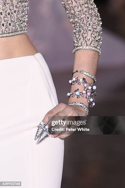 Model, jewel detail, walks the runway during the Georges Hobeika Spring Summer 2017 show as part of Paris Fashion Week on January 23, 2017 in Paris,...