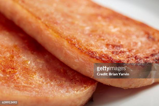 slices of grilled spam - spam stock pictures, royalty-free photos & images