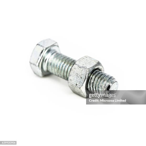 a steel bolt threaded onto a nut - microzoa stock pictures, royalty-free photos & images