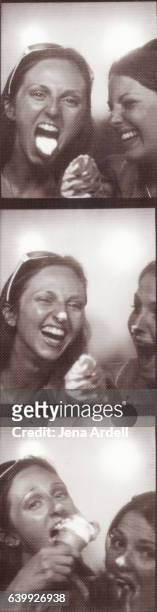 friends laughing inside photo booth - passport sized photograph stock pictures, royalty-free photos & images
