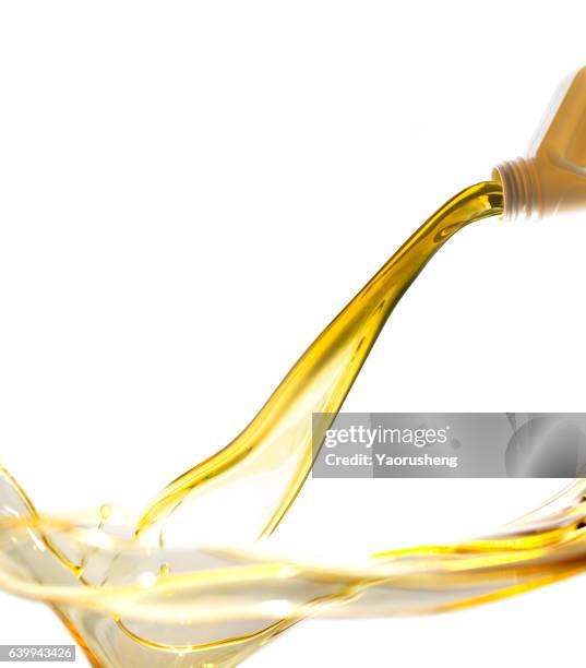 active oil splash in white background - oil flow stockfoto's en -beelden