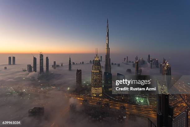 Aerial view of Dubai Skylines at Sunrise during a foggy Morning on December 28, 2016 in Dubai, United Arab Emirates.