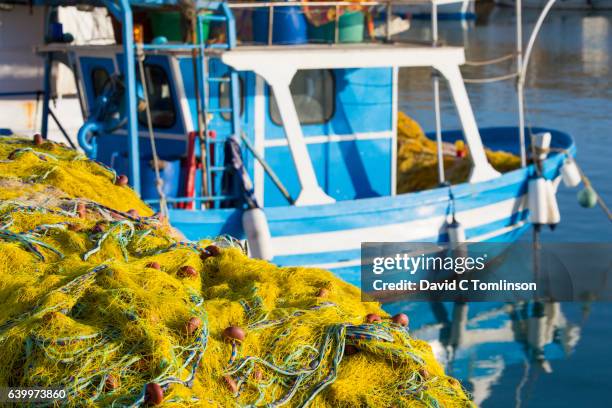 colourful fishing boat and nets in the venetian harbour, iraklio, crete, greece - herakleion stockfoto's en -beelden