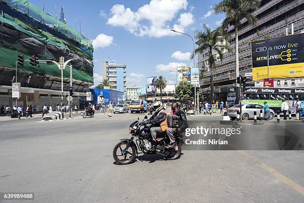 motorcyclist in nairobi - nairobi stock pictures, royalty-free photos & images