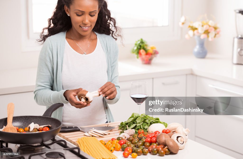 Woman making vegetarian dinner.