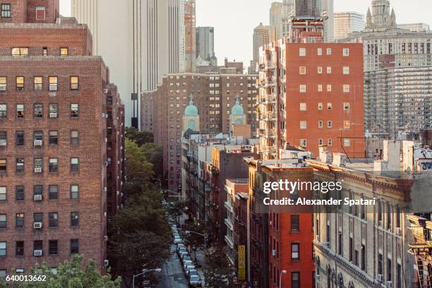 residential red brick building in lower east side, manhattan, new york city, ny, united states - brick building exterior stock pictures, royalty-free photos & images