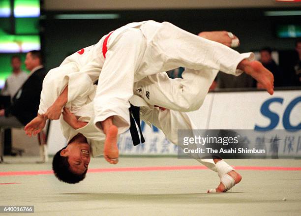 Tadahiro Nomura throws Masato Uchishiba in the -60kg semifinal during day one of the Kano Jigoro Cup Tokyo International Judo Championships at Nippon...